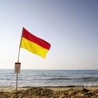Image of lifeguard flag on a beach. Credit Simon Gator 